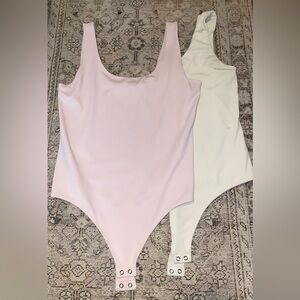 Two Express body contour bodysuits both size large. Bundled for $20.00